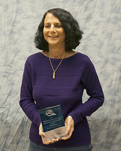 Photo of Nan Kanter and her award.