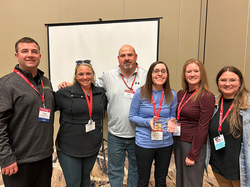 BVRC staff members pose with an award