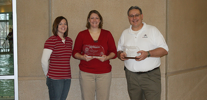Three aquatics professionals pose with their KRPA awards.
