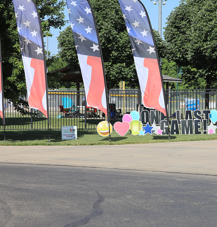 Flags mark the entrance to the Blue Valley Rec Sports Complex for a sports tournament competition.