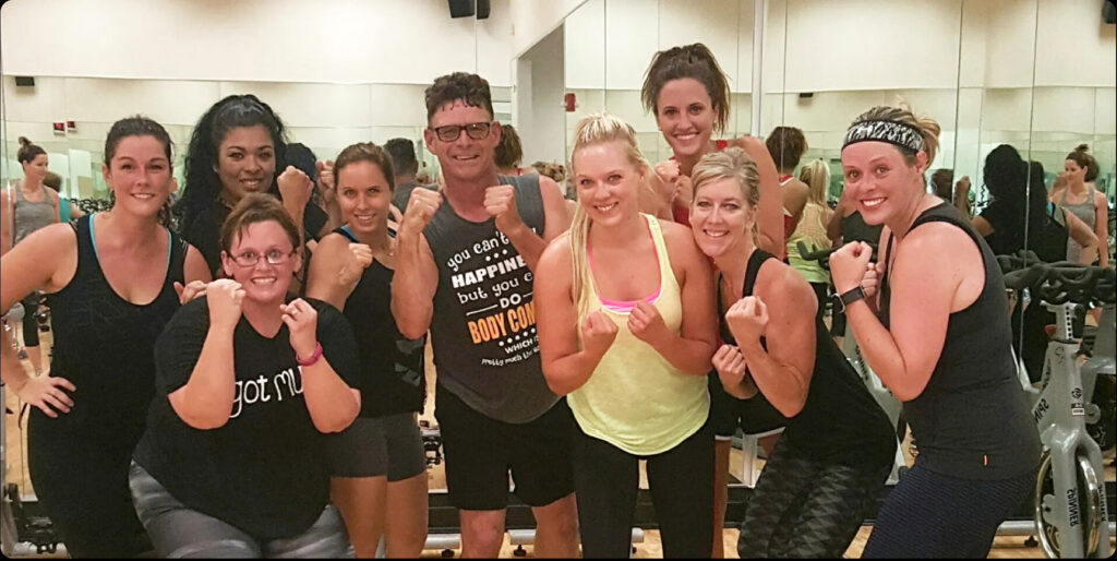 Fitness participants pose for a group photo.